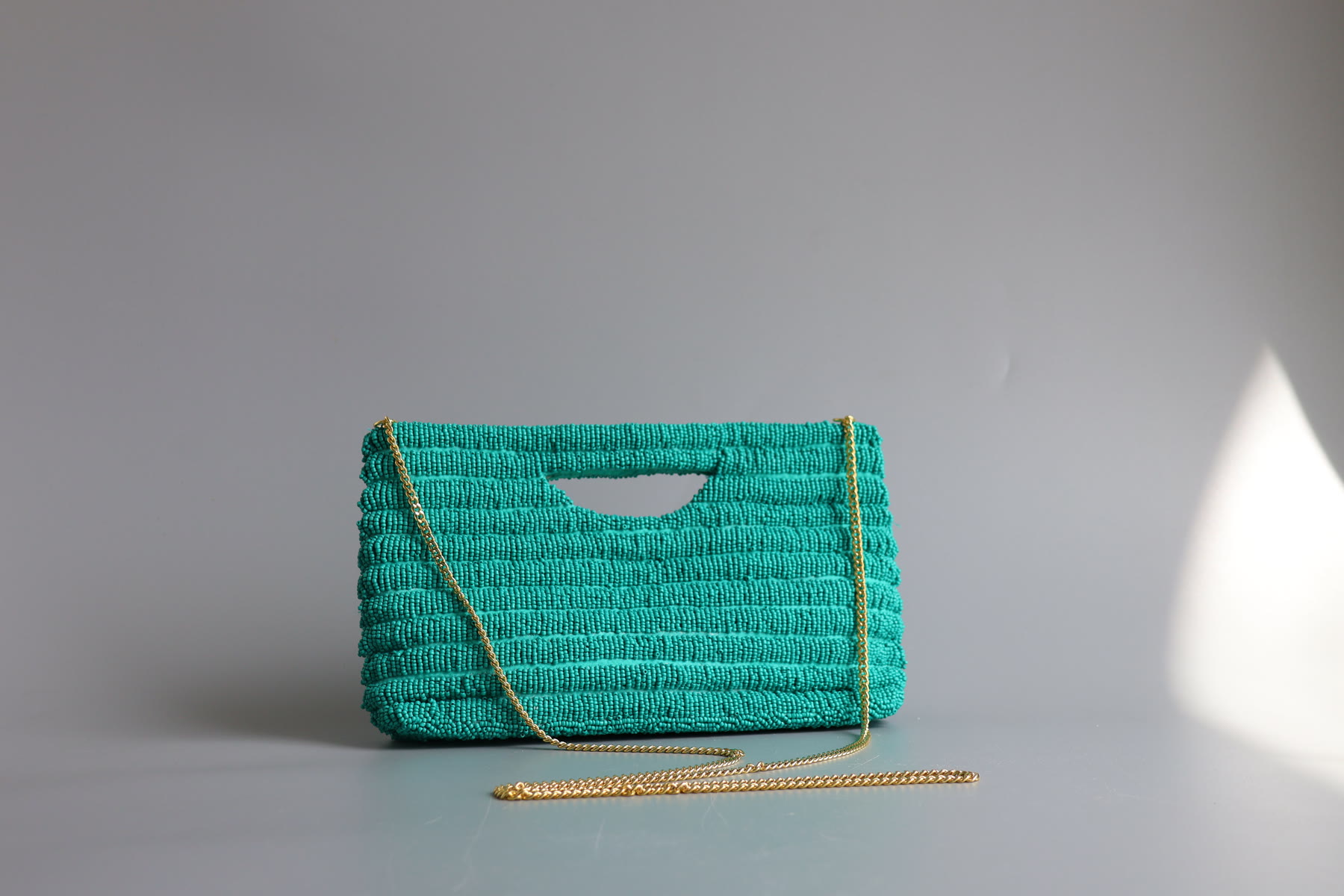 Arc Cutout Clutch by Celeste