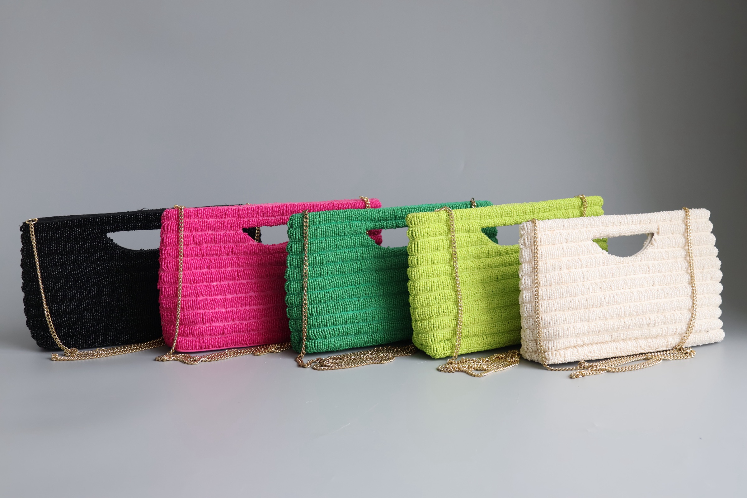 Five original beaded clutches in distinct colours
