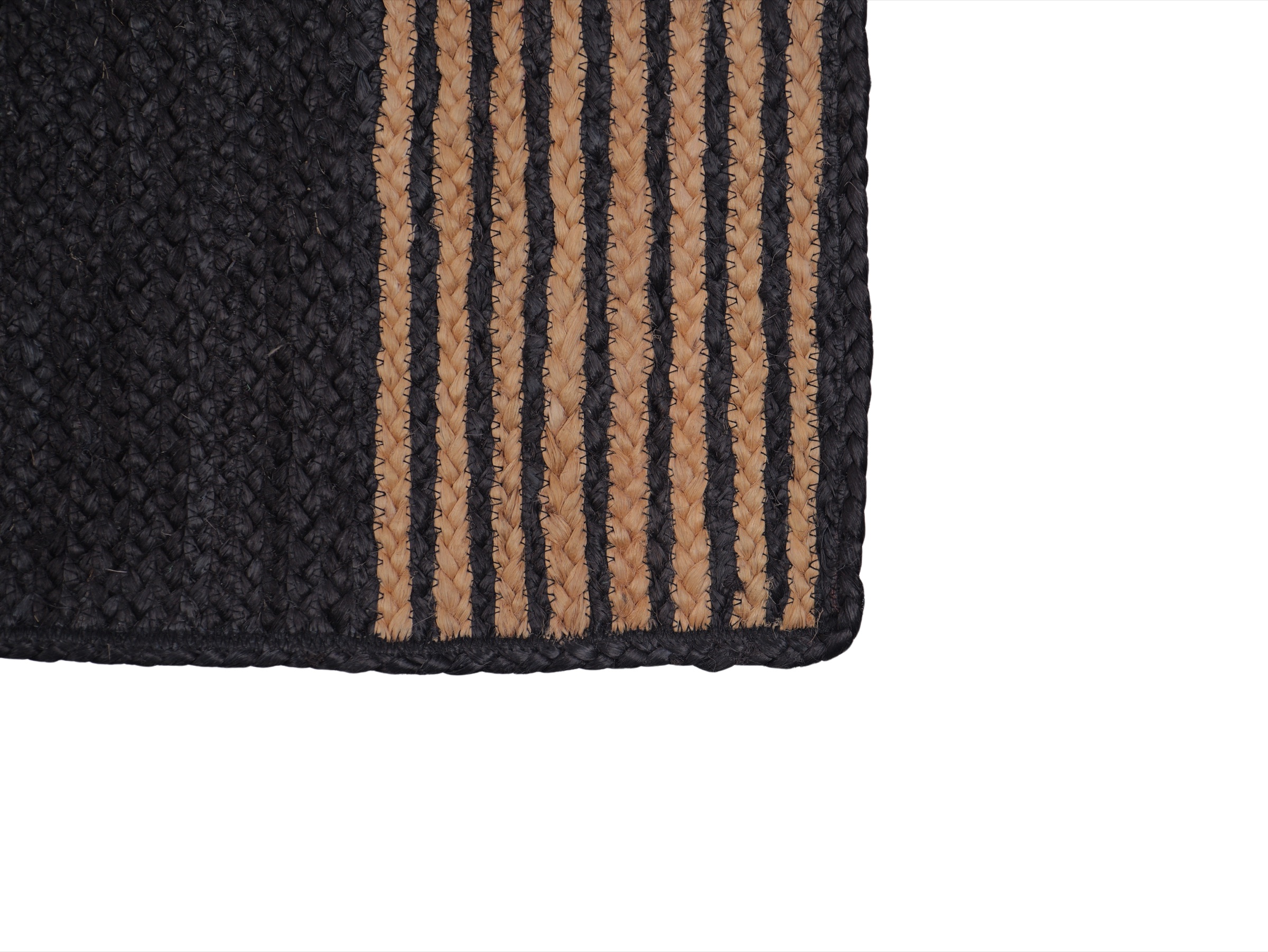 Close detail of the original black jute carpet