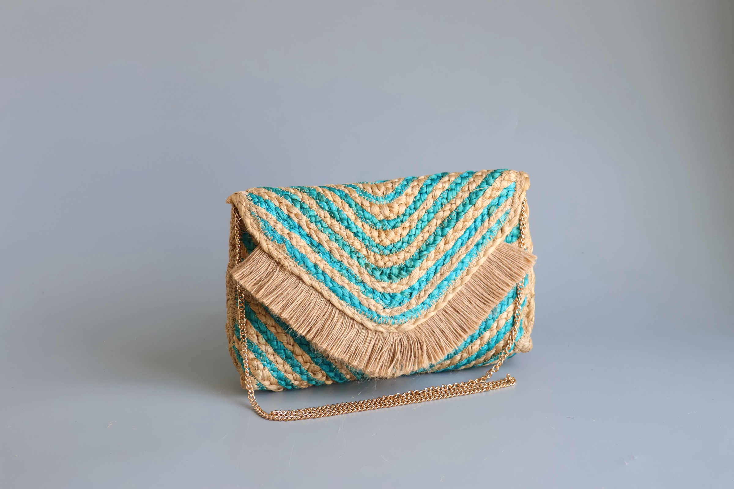 Original teal jute fringe chevron clutch